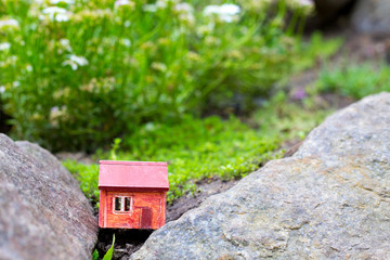 Red house on the mountain - stone, in the grass and moss
