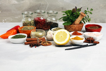 Spices and herbs on table. Food and cuisine ingredients with basil