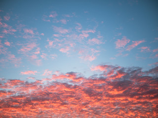 Blue sky and orange clouds during sunrise