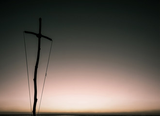 the wooden cross at sunset