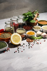Spices and herbs on table. Food and cuisine ingredients with basil