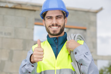 portrait of a smiling electrician at work