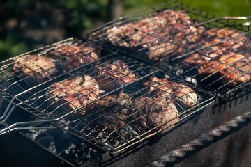 grilled pork are cooked outdoors, summer picnic, close-up.