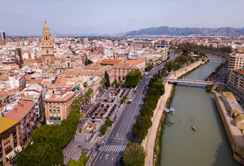 Fototapeta Aerial view of part of european city  Murcia with coast line of segura river obraz