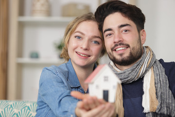 happy family couple embracing in a new house