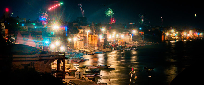 Beautiful night panorama skyline view of the ghats and Ganges River in Varanasi, India on Divali