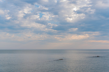 Fototapeta premium Clouds and blue sky over calm lake