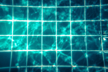 Swimming pool water background with transparent turquoise water and net pattern in vintage style