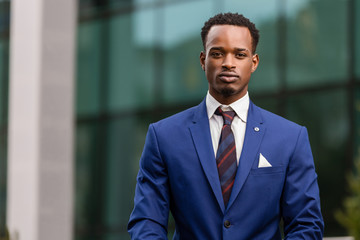 Outdoor standing portrait of a black African American business man
