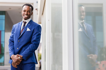 Outdoor standing portrait of a black African American business man