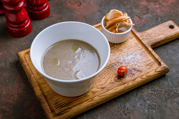 Cream soup of mushrooms on bowl