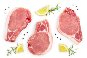 sliced raw pork meat with rosemary and lemon isolated on white background. Top view. Flat lay