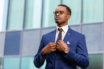 Outdoor standing portrait of a black African American business man