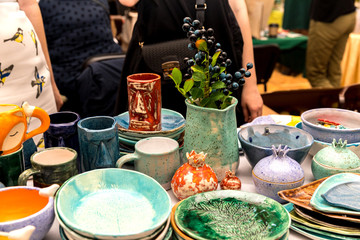 Handmade ceramics on the market. Mugs, plates
