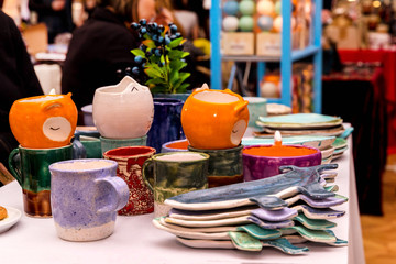 Handmade ceramics on the market. Mugs, plates