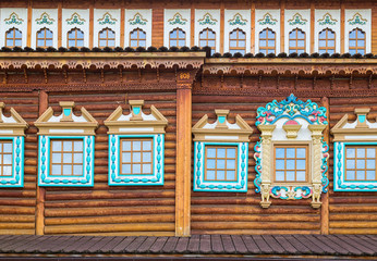 Fototapeta premium Decorated windows in old wooden house