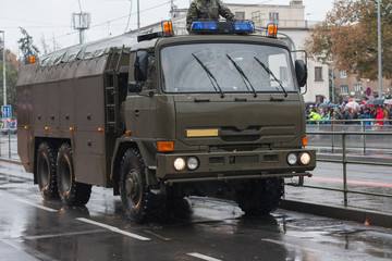 Soldiers of Czech Army are riding decontamination vehicle  on military parade