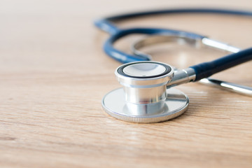 medical stethoscope on wood background