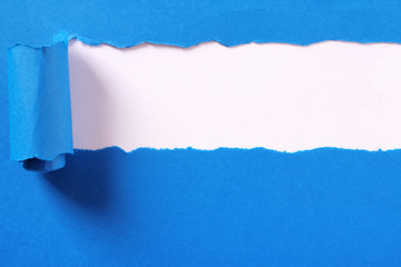 Torn blue paper strip headline white background frame