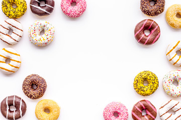 Modern design with bright donuts frame on white background top view mock up