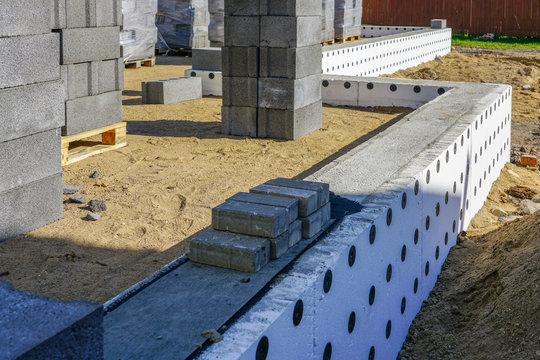 Concrete Foundation Of A New House, View Of Construction Site In Preparation Process