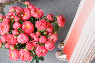 Coral peonies in a metal vase. Beautiful peony flower for catalog or online store. Floral shop concept . Beautiful fresh cut bouquet. Flowers delivery