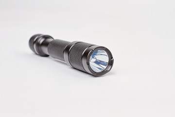 Black torch. White isolated background.