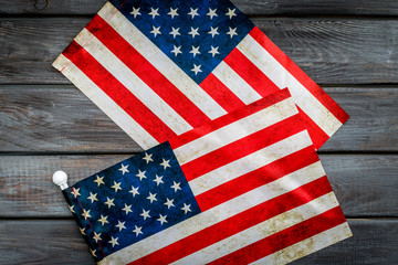 Memoral day of United States of America with flag on gray wooden background top view