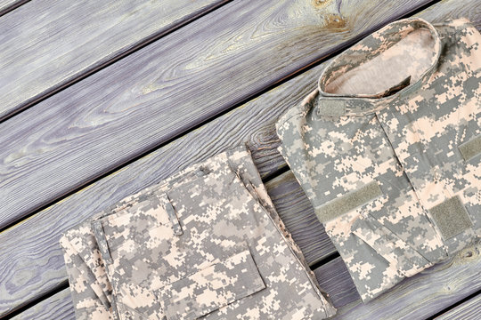 Folded Camouflage Jacket And Pants. Close Up, Top View.