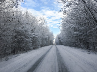 Road in the snow. Slippy road. Beautiful landscape of a snowy road stretching into the distance