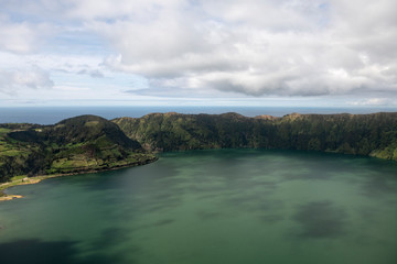 Fototapeta premium aerial landscape of the impressive volcanic crater with Lagoa Azul at Sete Cidades