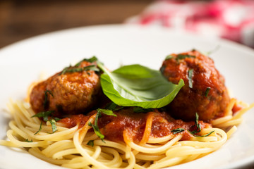 Beef meatballs with bolognese sauce and spaghetti.