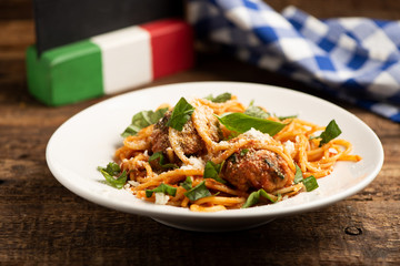 Beef meatballs with bolognese sauce and spaghetti.