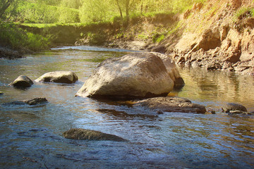 The picturesque landscape of the stormy river.