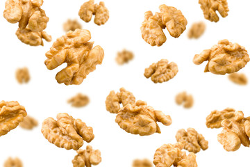 Falling walnut, nut, isolated on white background, selective focus