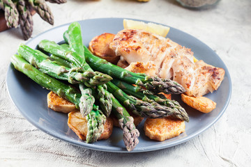 Fried cod fillet with green asparagus