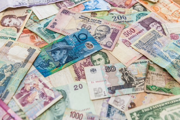 Perspective of blue money bill on other banknotes