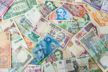 Fototapeta na wymiar Colorful background made of used international money bills