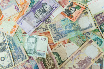 Many different international money bills / banknotes