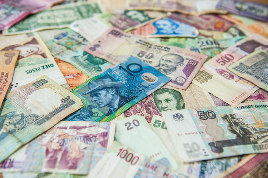 Blue money bill in front of different international banknotes