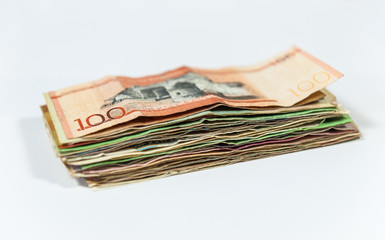 Pile of international banknotes on white background