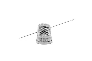sewing needle with metal thimble, on white background