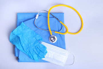Medical stethoscope lying on a blue doctor's form and notepad close-up. the therapist's work space.