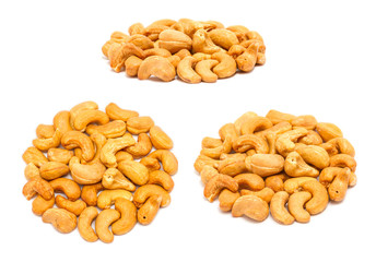 Set of handfuls of nuts from different angles - roasted cashew (Anacardium occidentale) without shell, close up, isolated on white background