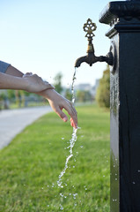 Man washes his hands