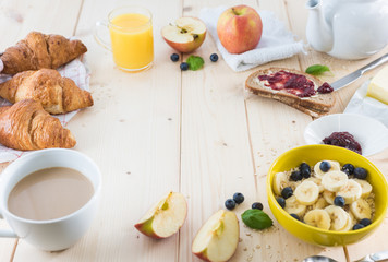 Breakfast on a wooden simple table.. Croissants Breakfast with aromatic tast. Good morning, great start to the day.