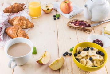 Breakfast on a wooden simple table.. Croissants Breakfast with aromatic tast. Good morning, great start to the day.