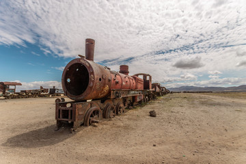 Fototapeta na wymiar Rusty train in train cemetery, in Uyuni Bolivia