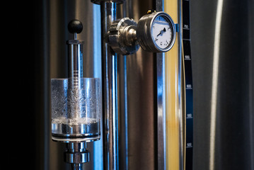 Pressure gauge of a beer plant brewery, close-up