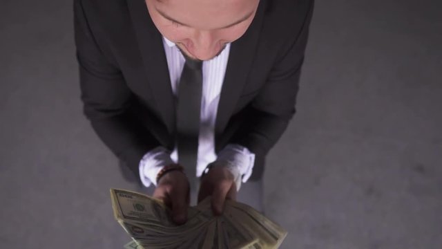 Businessman Throws Money